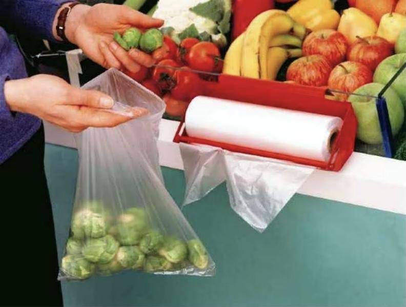 Fruit bag roll at a supermarket produce stand